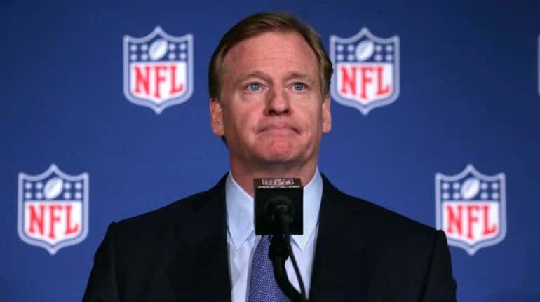 NFL commissioner Roger Goodell listens to a question during a...