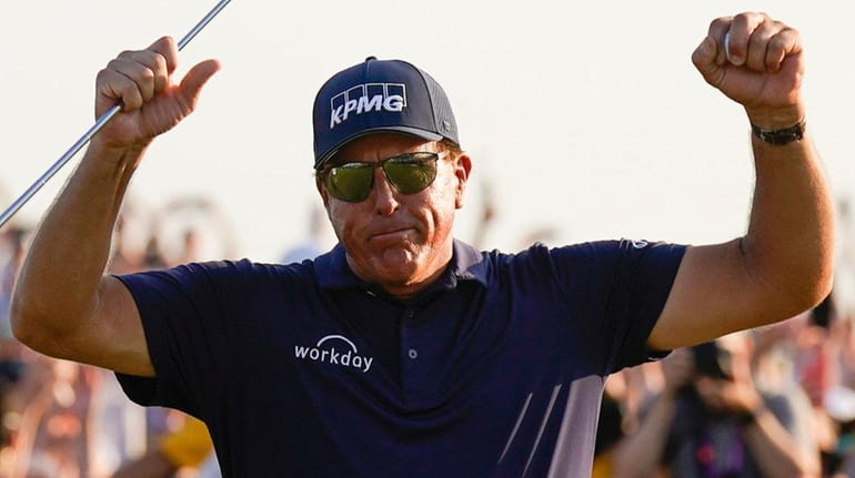 Phil Mickelson celebrates after winning the final round at the...