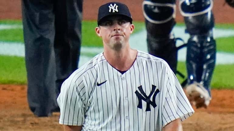 Yankees relief pitcher Clay Holmes pauses during the ninth inning...