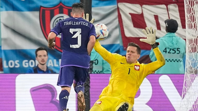 Poland's goalkeeper Wojciech Szczesny, right, makes a save in front...