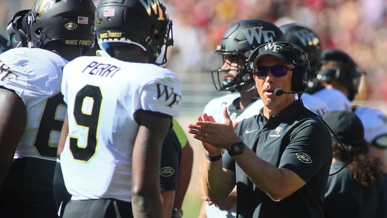 Wake Forest head coach Dave Clawson reacts in the first...