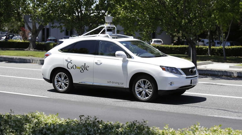 A Google self-driving car goes on a test drive on...