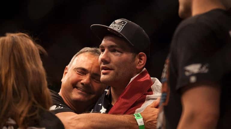 Chris Weidman celebrates his victory over Lyoto Machida at UFC...