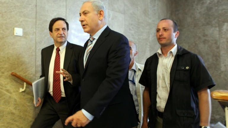 Israelii Prime Minister Benjamin Netanyahu, center, arrives to his Jerusalem...