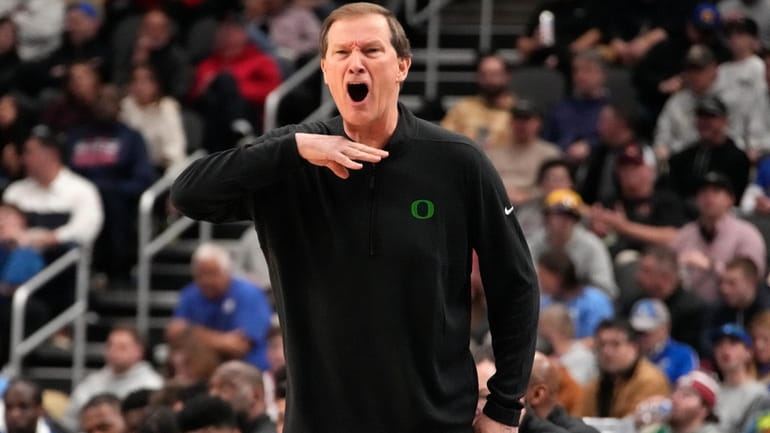 Oregon head coach Dana Altman yells instructions during the first...