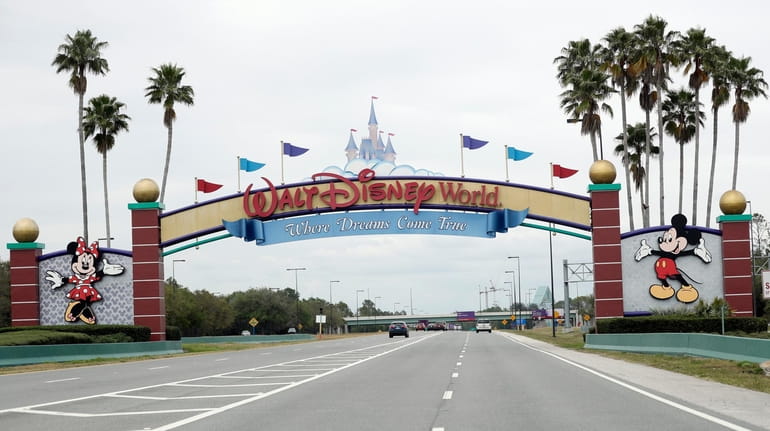 The road to the entrance of Walt Disney World has...