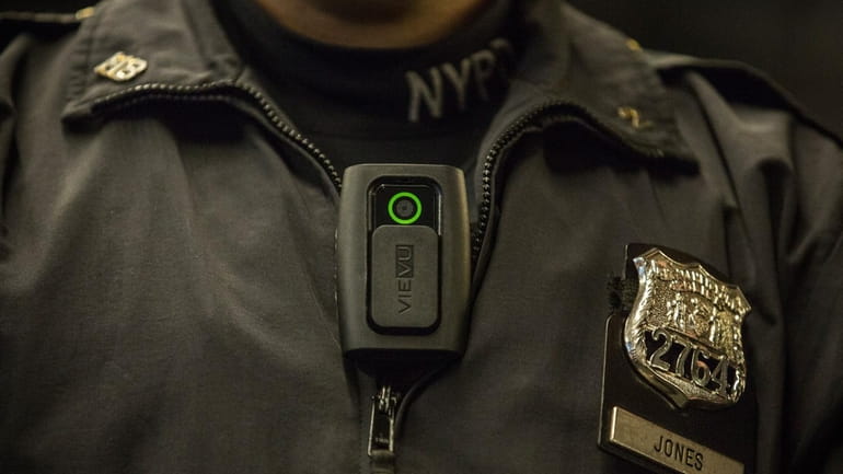 NYPD officers will begin wearing body cameras during patrol beginning...