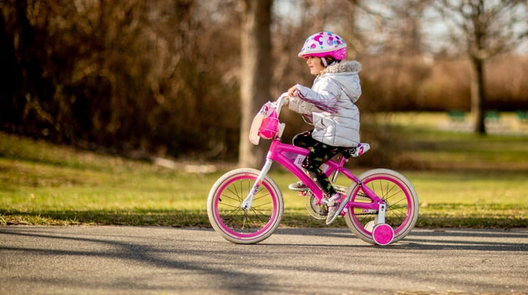 Brooke Conolly, 4, of Seaford practices riding her bike at...