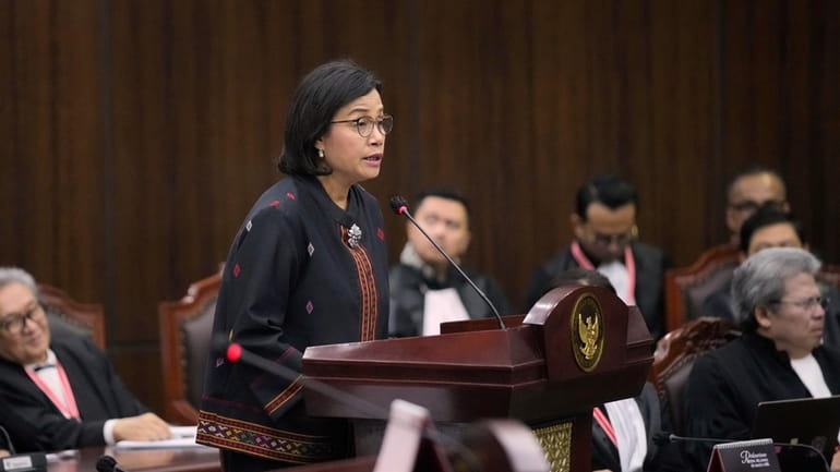 Indonesian Finance Minister Sri Mulyani Indrawati delivers her statement during...