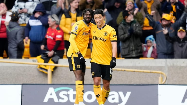 Wolverhampton Wanderers' Hwang Hee-Chan, right, celebrates scoring against Luton Town...