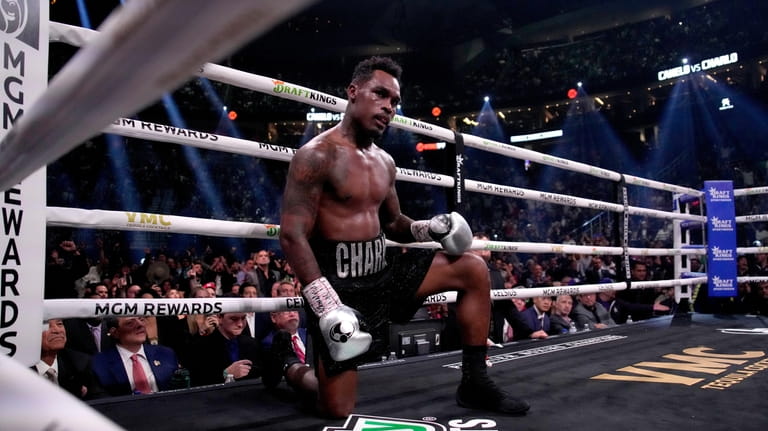 Jermell Charlo kneels after being knocked down by Canelo Alvarez,...