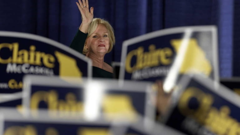 Sen. Claire McCaskill, D-Mo., waves to the crowd as she...