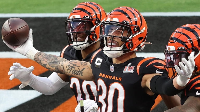 Jessie Bates of the Bengals reacts with his team following...