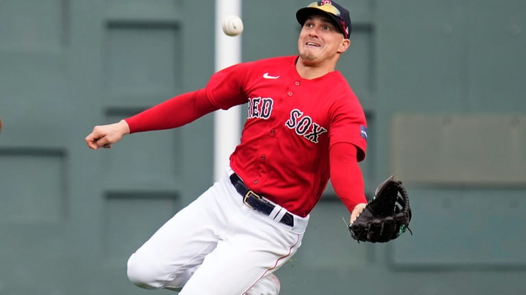 Boston Red Sox center fielder Enrique Hernandez makes the play...
