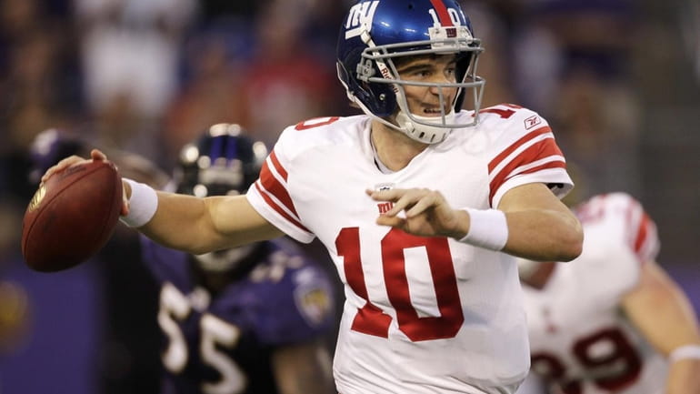 New York Giants quarterback Eli Manning throws a pass against...