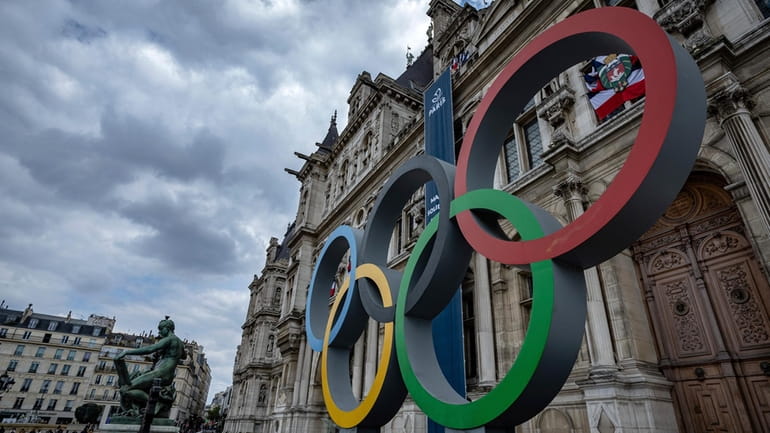 The Olympic rings are seen in front of the Paris...