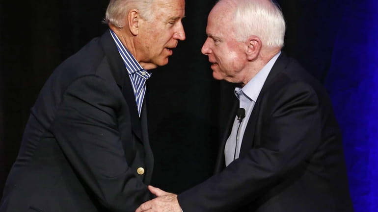 Vice President Joe Biden and Sen. John McCain, R-Ariz., shake...