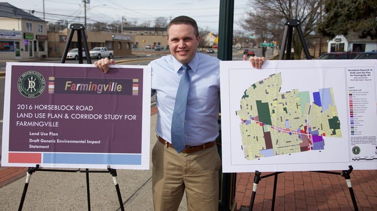 Brookhaven Town Councilman Kevin LaValle stands with a draft land...
