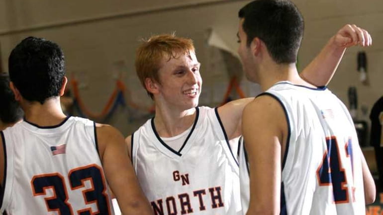 Great Neck North's Alec Ludwig, center, Jonah Gorjian, left, and...