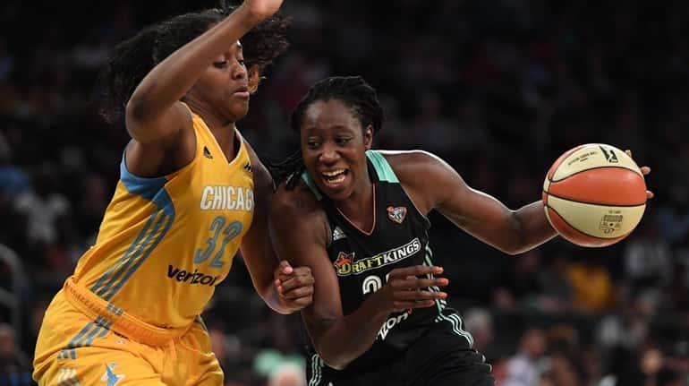 Liberty center Tina Charles drives to the basket against Chicago...