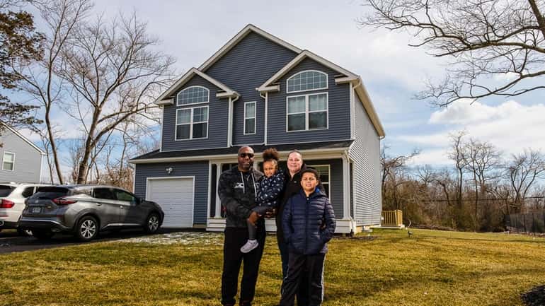 Darrel Callender with his wife, Dana, son, Dominic,  9, and...