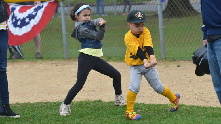 Kids practice their swings at Wantagh Little League opening day...