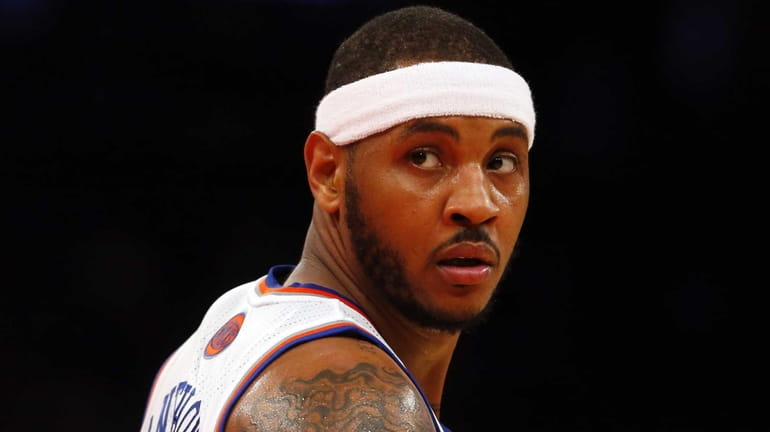 Carmelo Anthony looks on against the Brooklyn Nets at Madison...
