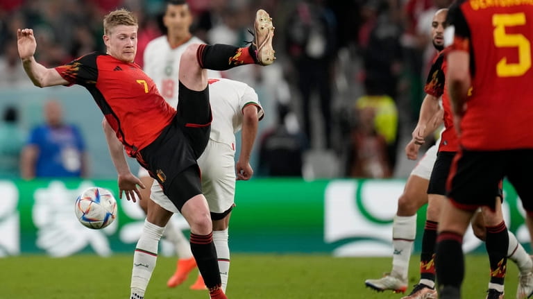 Belgium's Kevin De Bruyne fights for the ball during the...