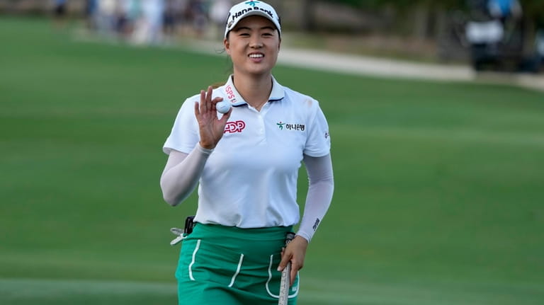Minjee Lee, of Australia, acknowledges the crowd on the 17th...