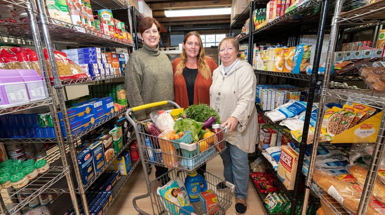 Southold CAST executive director Cathy Demeroto, from left, food pantry...