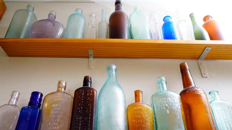 A bottle collection of Mike Cavanaugh, of East Rockaway, is...