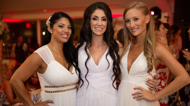 Brides of Long Island Facebook group administrator Caitlyn Wells, left, with...