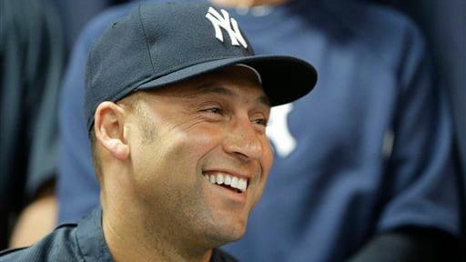 Derek Jeter listens to pitcher Mariano Rivera announce his plans...