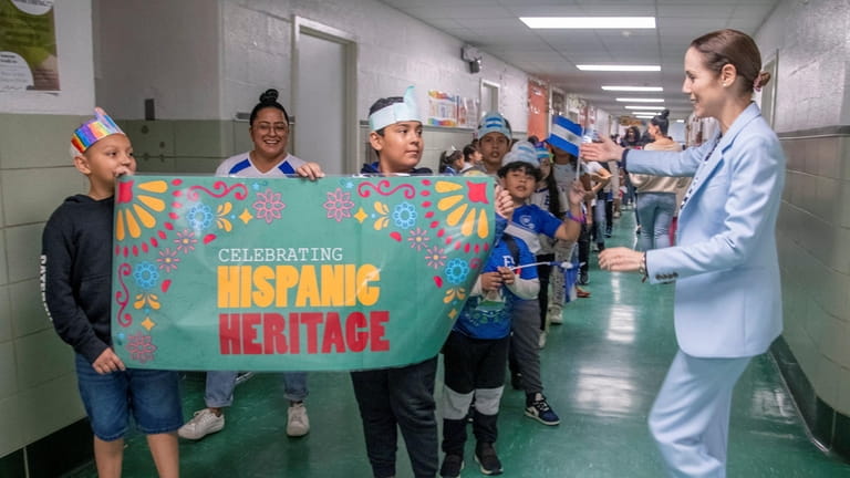 Wanda Ortiz-Rivera attends a Hispanic Heritage Month celebration parade Friday at...