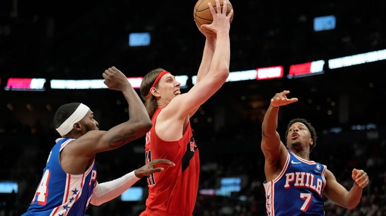 Toronto Raptors forward Kelly Olynyk (41) drives to the basket...
