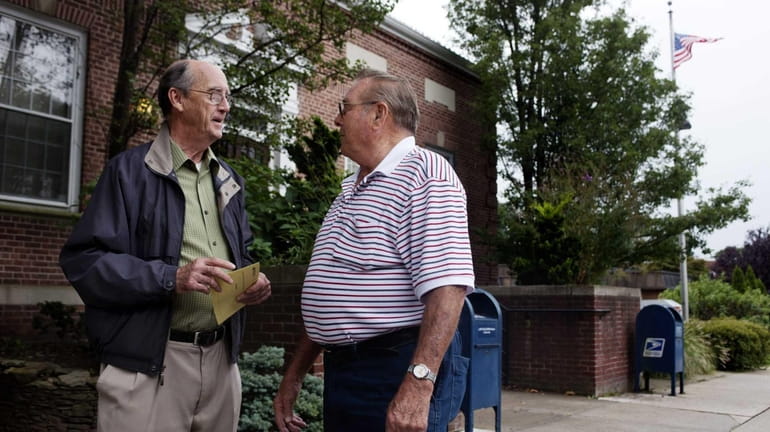 Longtime Northport residents John Brooks, left, and Robert Clelland chat...