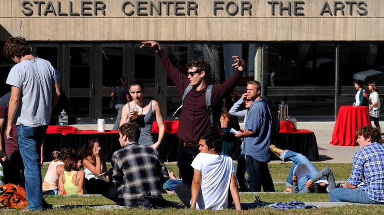Stony Brook University students relax between classes outside the Staller...