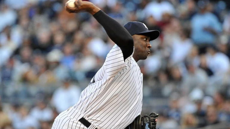 New York Yankees relief pitcher Rafael Soriano (29) throws in...