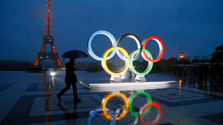 A display of the Olympic rings is set up on...