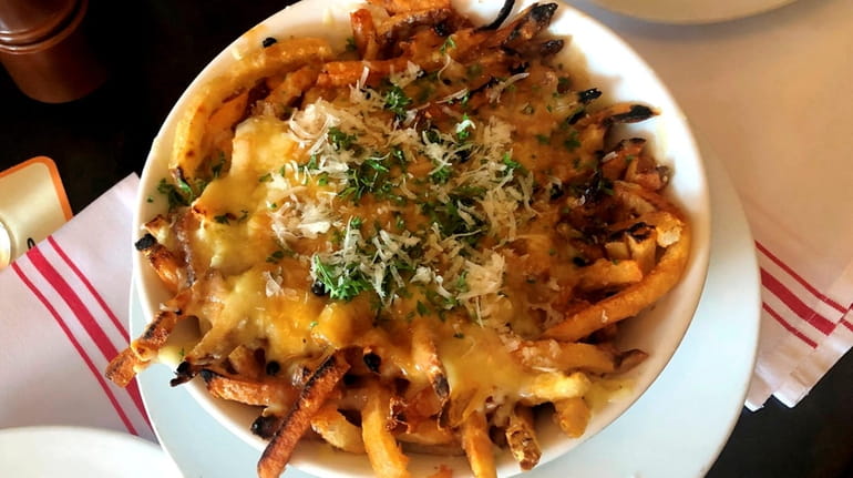 Fries Mansour with Gruyere cheese and au poivre sauce at...