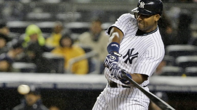 New York Yankees' Juan Miranda hits a home run during...