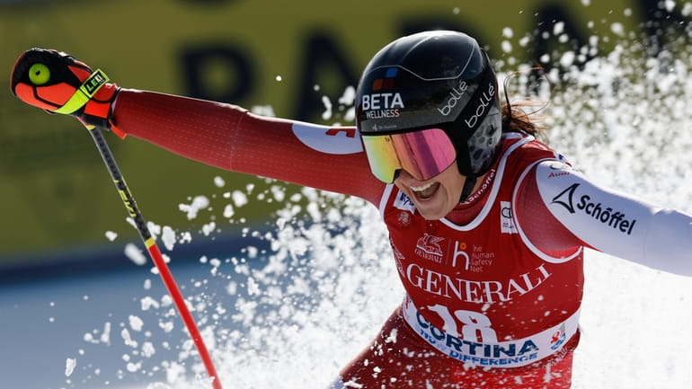 Austria's Stephanie Venier celebrates at the finish area of an...