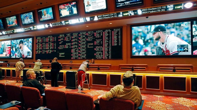 People place bets at the South Point hotel and casino...