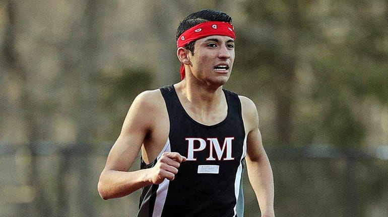 Patchogue-Medford's Carlos Santos of Patchogue-Medford runs the 3,000 steeplechase on...