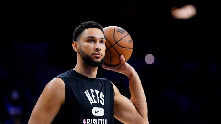 FILE - Brooklyn Nets' Ben Simmons watches practice before an...