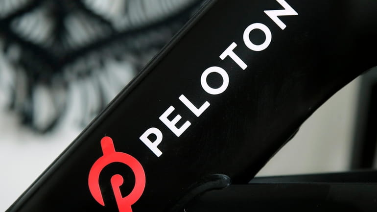 A Peloton logo is seen on the company's stationary bicycle in...