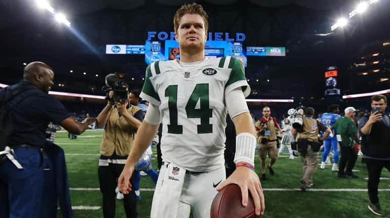 Sam Darnold of the Jets exits the field after the...