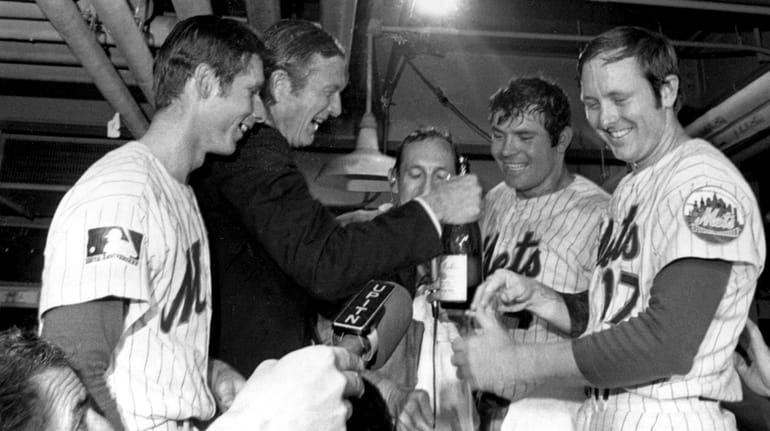 New York City Mayor John Lindsay celebrates with the Mets in...