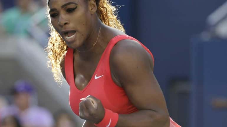 Serena Williams reacts after a point against Victoria Azarenka during...