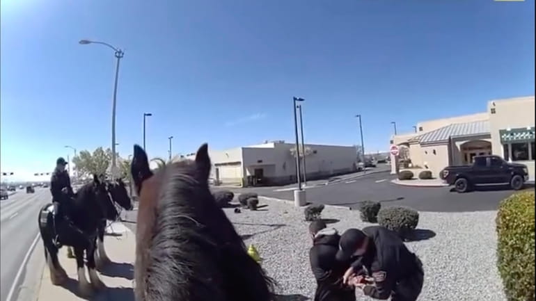 This photo taken from Albuquerque Police Department police video shows...